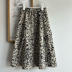 Black and cream colored skirt